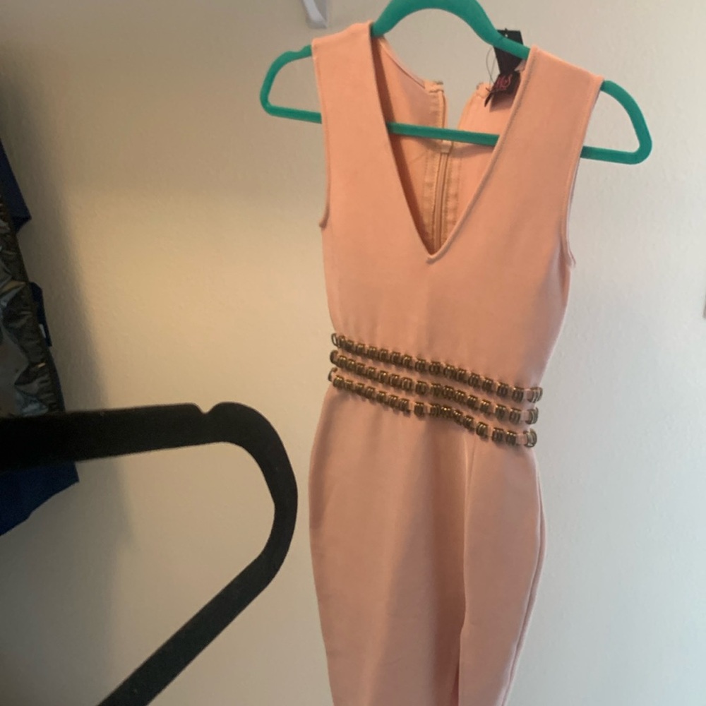 Brand new hot Miami style body con dress color is like a light pink